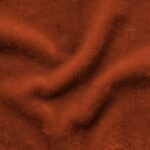 High-resolution swatch of Mohair Velvet in Burnt Copper, showing a dense, lustrous pile in a rich metallic-orange hue that reflects light across its silky surface.