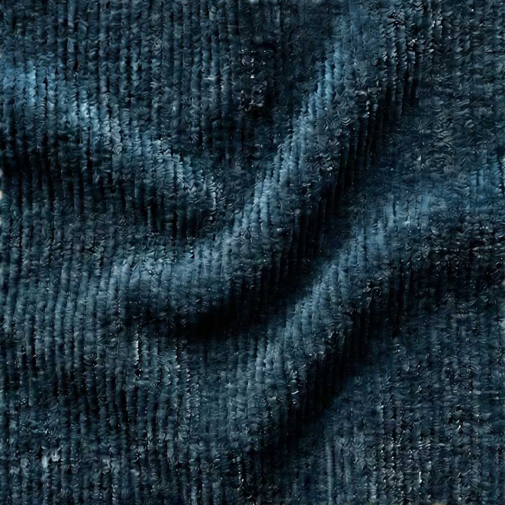Close-up swatch of Performance Chenille fabric in Oceanic Indigo, showing a dense, fuzzy texture and a rich, multi-tonal weave of deep navy and inky blue threads.