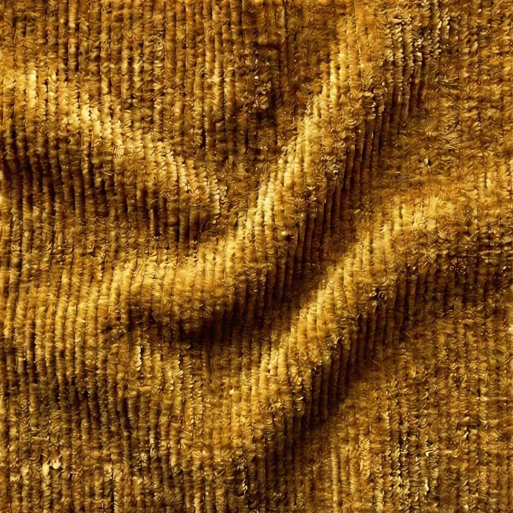 High-resolution swatch of Performance Chenille fabric in Ochre Gold, showing a dense, fuzzy texture and a multi-tonal weave of warm amber and golden-yellow threads.