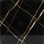 A close-up of a Sahara Noir marble slab, displaying a flat, intense black background crisscrossed by sharp, geometric linear veins in vibrant gold, oxide orange, and white.