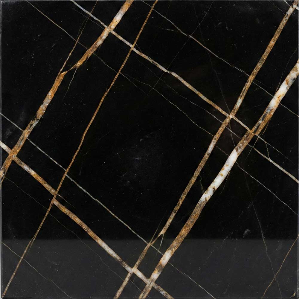 A close-up of a Sahara Noir marble slab, displaying a flat, intense black background crisscrossed by sharp, geometric linear veins in vibrant gold, oxide orange, and white.