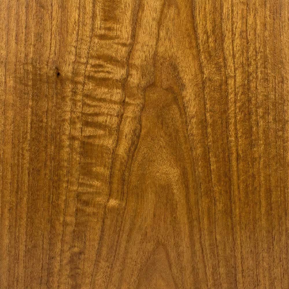 A close-up of a polished Gold Eucalyptus veneer, displaying a rippled, iridescent grain pattern in varying shades of honey, amber, and golden-brown.