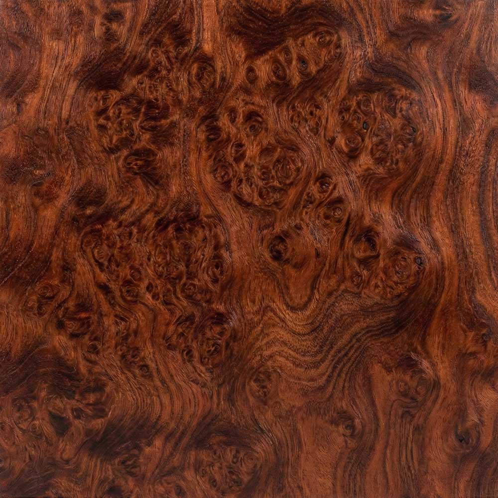 A detailed close-up of a Redwood Burl veneer, showcasing a deep, russet-red background filled with complex, swirling grain patterns and tight clusters of dark knots.
