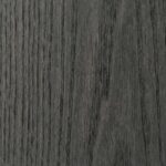 A detailed macro shot of a Grey Ash surface with an open-pore finish, revealing deep, physical grain textures and ridges in a cool, matte grey tone.