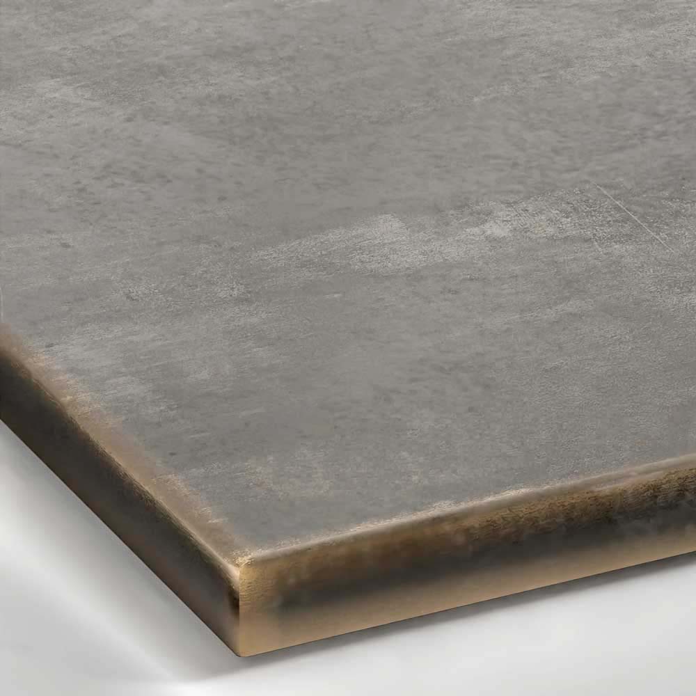 A close-up view of a Patina Bronze metal surface, showcasing a dark, warm brownish-bronze tone with subtle variations in color and a soft, hand-rubbed satin sheen.