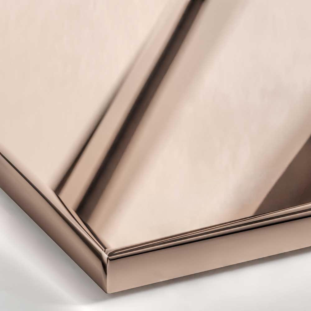 A close-up view of a Polished Rose Gold metal surface, characterized by a bright, reflective mirror finish with distinct pink and copper hues.