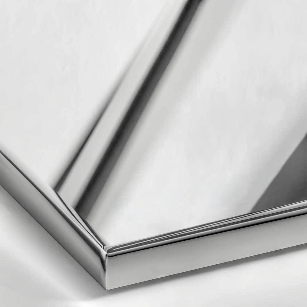 A close-up of a Polished Stainless Steel surface, featuring a bright, cool silver tone with a perfect, mirror-like reflectivity.